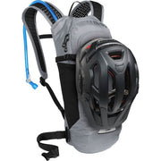 Camelbak Lobo 9 Hydration Pack 70oz, Gunmetal, View with a helmet secured to the backpack