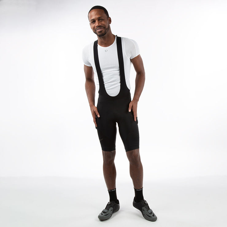 PEARL iZUMi Interval Cargo Bib Shorts, front view on model. 