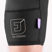 Black compression shorts with a logo and text on a white background