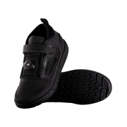 Black cycling shoe with sole design on a white background