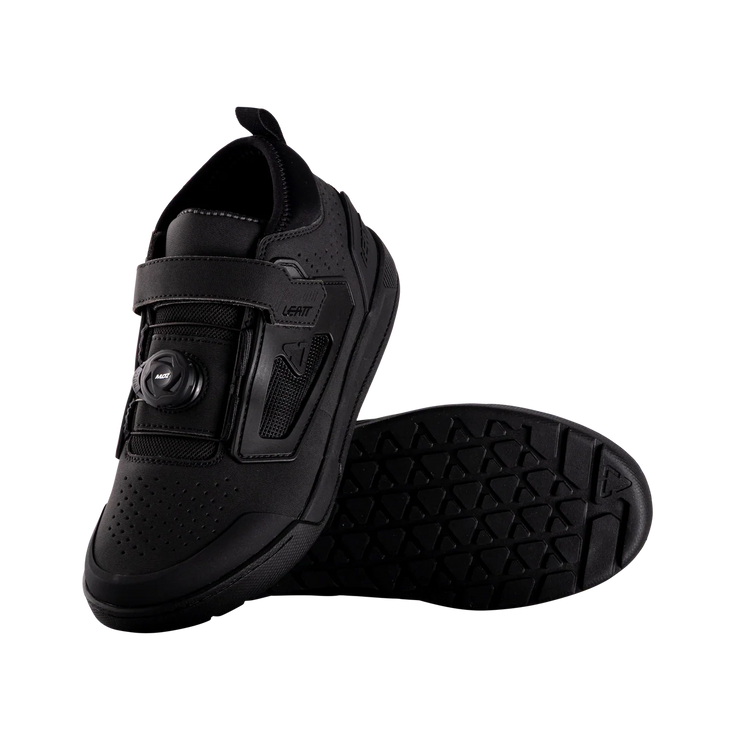 Black cycling shoe with sole design on a white background