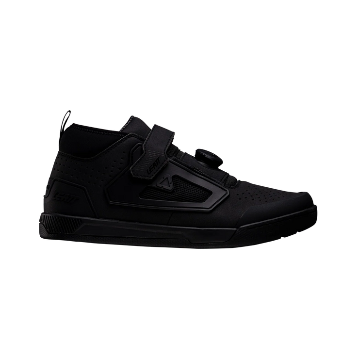 Black high-top sneaker with velcro straps on a white background