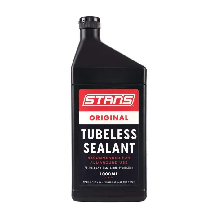 Black bottle of Stans Original Tubeless Sealant on a white background