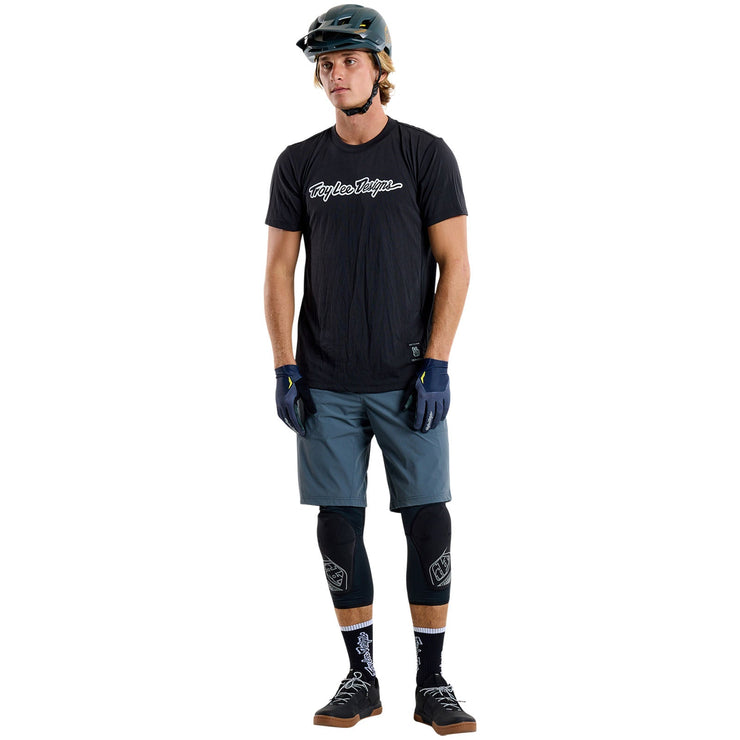 Troy Lee Designs Skyline Short Sleeve Ride Tee, black, front view on model. 
