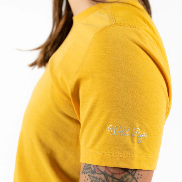 Wild Rye Salida Women's MTB Jersey, Golden Yellow, side view on a model