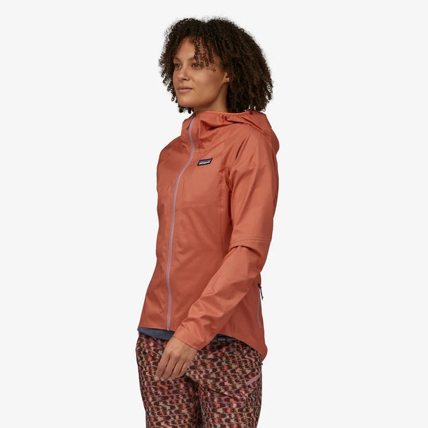Patagonia Women's Dirt Roamer Jacket, quarts coral, front view on model.