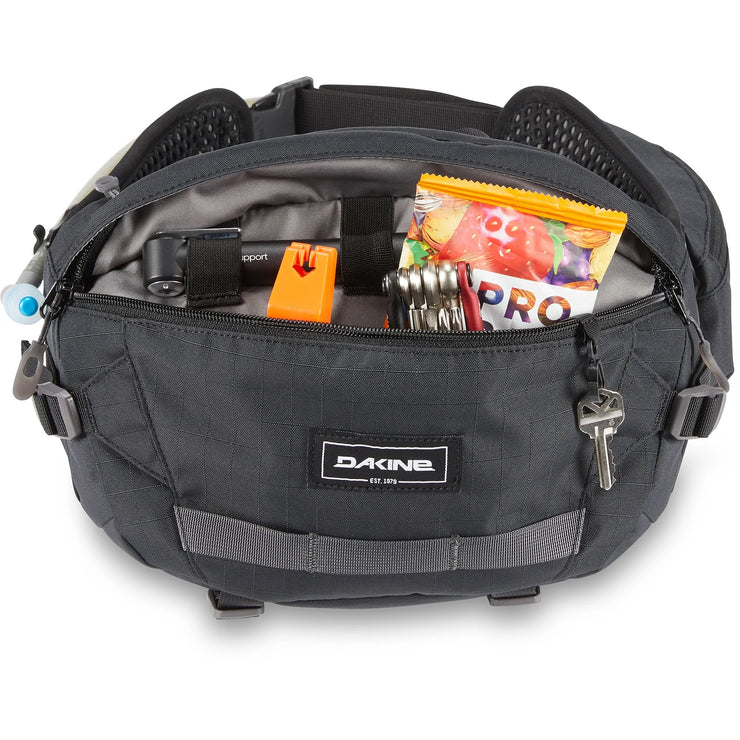 Dakine Hot Laps Pack 5L Hip Pack, Black. Modeled with bike accessories.