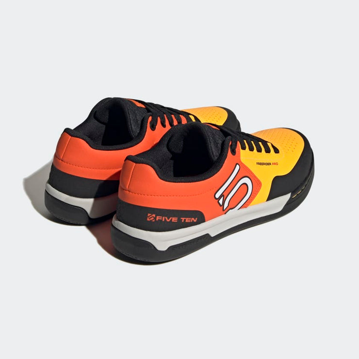 Five Ten Men's Freerider Pro Shoe Media 28 of 36, solar gold / cloud white / impact orange, pair heel view.
