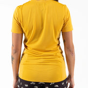 Wild Rye Salida Women's MTB Jersey, Golden Yellow, back view on a model