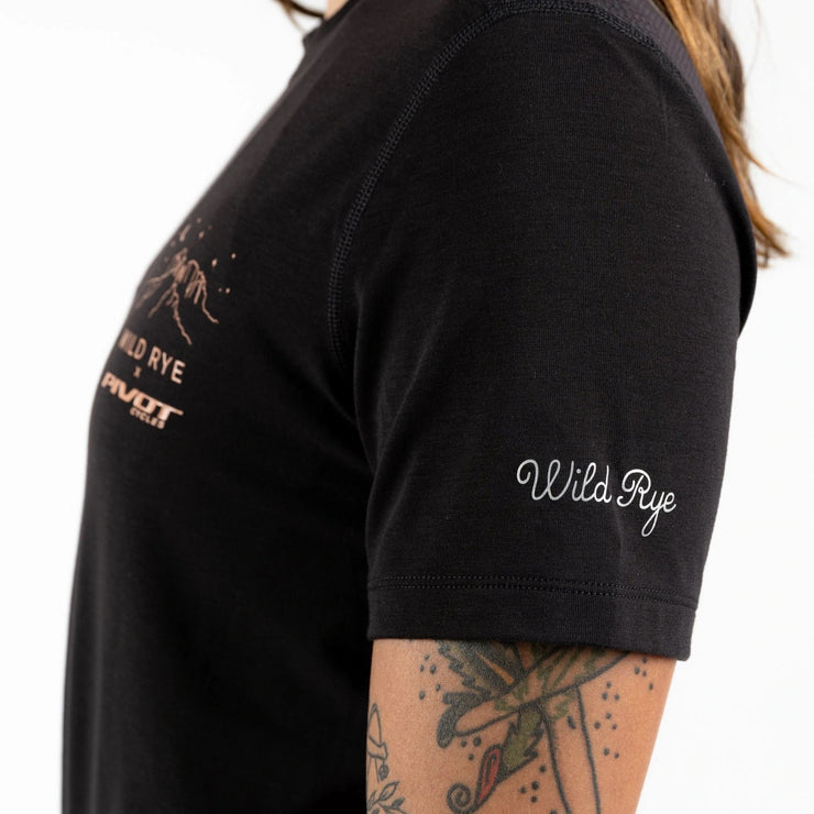 Wild Rye x Pivot Cycles Collaboration - Salida Women's MTB Jersey, Sedona Nights Black, Closeup view of Wild Rye logo on sleeve