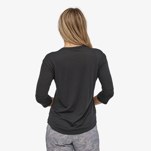 Patagonia Women's Merino 3/4-Sleeved Bike Jersey, black, back view on model.